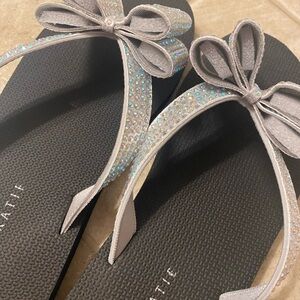 Brand new bow flip flops.
